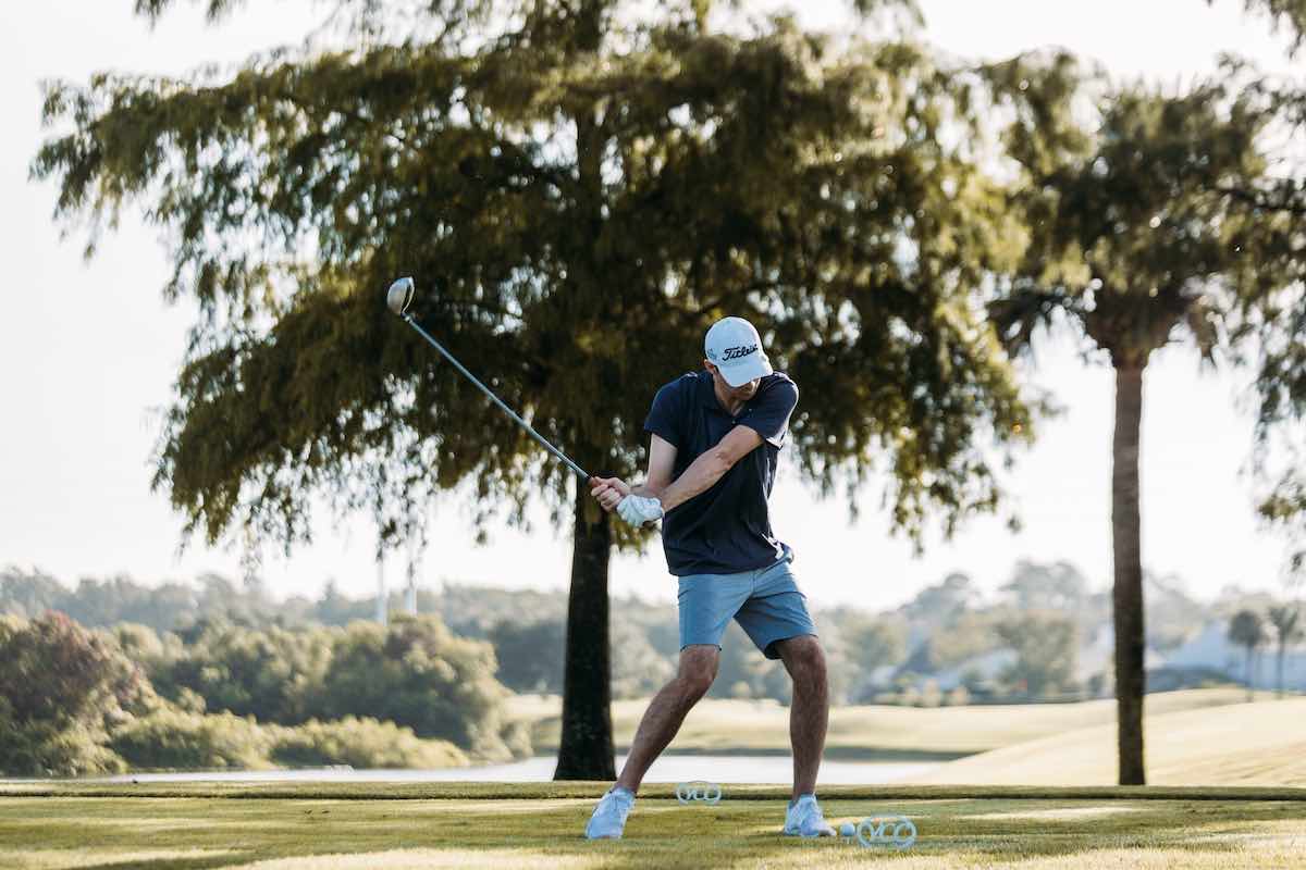 Man hitting tee shot with massive driver